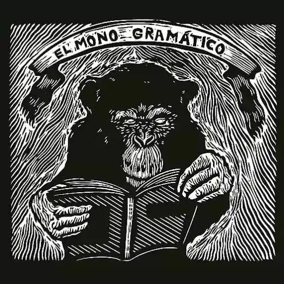 Grabado de un chimpancé leyendo un libro bajo una filacteria con el nombre El Mono Gramático